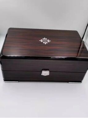 Patek Philippe Brown and Black High-Gloss Wood Watch Box with Silver Emblem